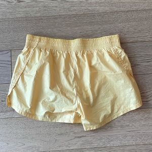 Nike yellow running shorts, size S